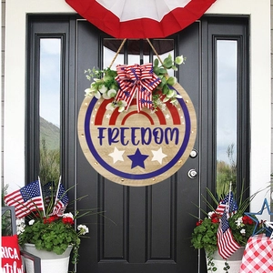 Patriotic July 4th wooden door hanger with blue Freedom text and stars decoration