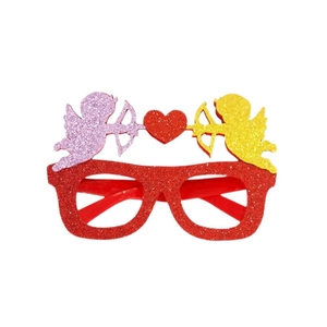 Red glitter Valentine's Day party glasses with Cupid and heart decorations on white backdrop