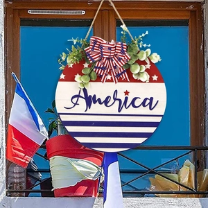 Patriotic wooden round door sign with America text, stars and stripes for July 4th decor