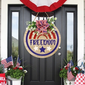 Patriotic freedom wood door hanger with red white blue stars and bow for independence day