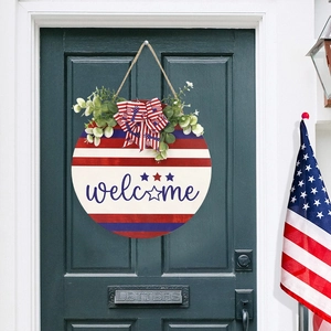 Independence Day round wooden welcome sign with patriotic bow and greenery for front door