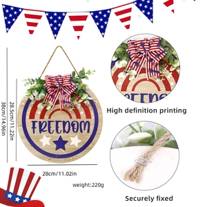 Independence Day round wooden freedom sign with red white and blue bow and greenery decoration