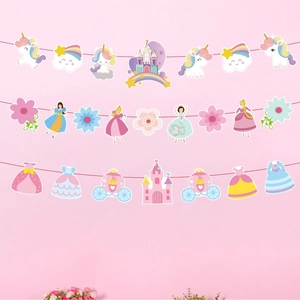 Close-up of unicorn, princess, and castle themed paper banners for party decoration