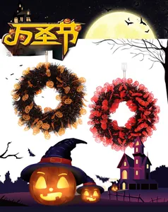 Detail of Halloween tinsel wreaths with pumpkin ornaments in orange and black