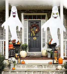 Close-up of two hanging Halloween ghost windsocks for outdoor yard patio decoration