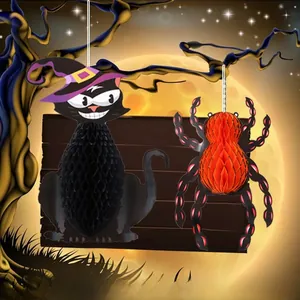 Close-up of Halloween black cat and spider paper honeycomb ornaments for party decoration