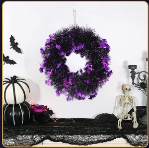 Halloween wreath with purple bats and metallic tinsel for party wall decoration