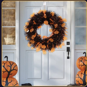 Close-up of Halloween wreath with black fringe and orange pumpkin sequins on white door