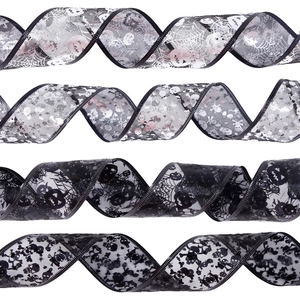 Detailed view of Halloween mesh ribbons with silver pumpkin and skull patterns on white backdrop