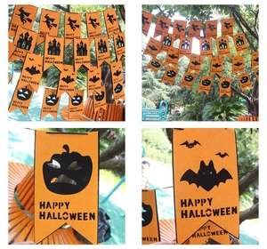 Detail of Happy Halloween banner with felt orange pumpkin and castle cutouts for parties