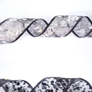 Detail of Halloween double-layer mesh ribbons with skull and spider web gold stamping