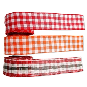 Red and white gingham plaid ribbons for Christmas tree decoration and gift wrapping