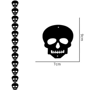 Close-up of 12 black skull pendants for Halloween decor with DIY string and dimensions