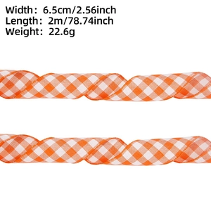 Detail view of 6.5cm width orange and white gingham ribbon for Christmas decoration