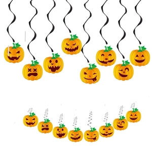 Detail showing various orange pumpkin swirl decorations for Halloween ceiling party layout