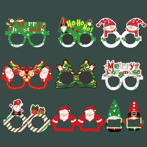 Set of nine festive Christmas paper glasses featuring Santa and reindeer party props