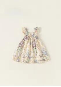 Vue détaillée d'une robe fleurie pour fille avec col à volants et bordures en dentelle