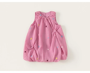 Close-up of pink sleeveless flower girl dress with star and heart embroidery detail