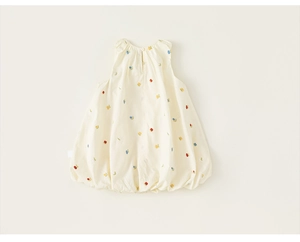 Close-up of baby girl sleeveless dress featuring colorful embroidery and bubble hem style