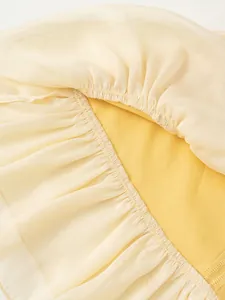 Abito a trapezio senza maniche per bambine giallo chiaro con volant e cuciture elastiche