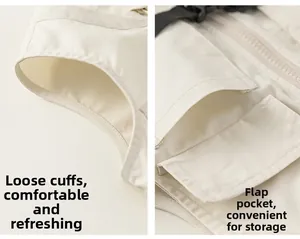 Close-up of loose cuffs and functional flap pockets on a beige outdoor utility jumpsuit