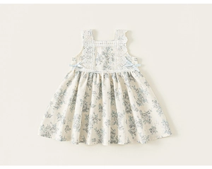 Detail of sweet floral girl dress with blue rose prints and white lace stitching
