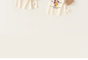 Detail of soft cotton kids t-shirt with cartoon girl print and woven side label