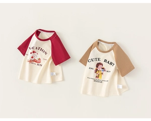 Detail view of cotton kids t-shirts with raglan sleeves and cute strawberry prints
