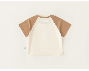 Detail of cotton contrast raglan sleeve T-shirt for kids with soft cream and brown tones