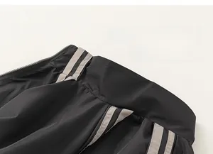 Detail of boys sports jacket featuring contrast gray stripes and high-quality stitching