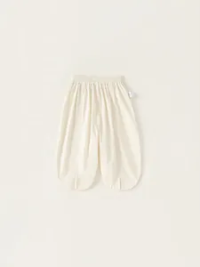 Girls loose cream cotton lantern pants with elastic waist and side slit leg openings
