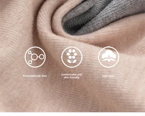 Detail of soft ribbed knit fabric in beige and grey with skin-friendly texture
