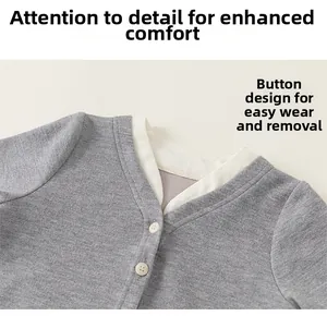 Detail of grey knitted cardigan with V-neckline, contrast trim and cream buttons