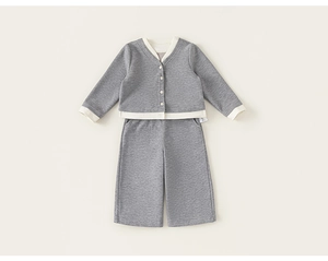 Detail view of children's grey knit set featuring a V-neck cardigan and matching trousers