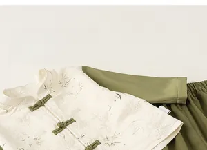 Detail of traditional Chinese knot buttons and bamboo leaf jacquard on kids set