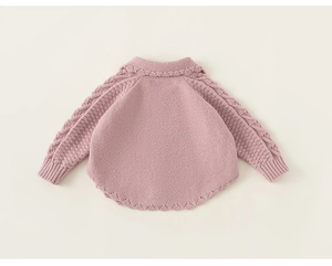 Detail view showing cable knit sleeves and scalloped edge on pink toddler cardigan