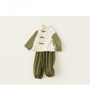 Detail of boys' Chinese style outfit with bamboo print and traditional frog buttons