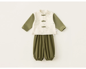 Detail of traditional Chinese kids' set featuring bamboo patterns and oriental frog buttons