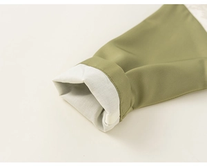 Detail of boys' traditional Chinese suit sleeves with green twill and cotton lining