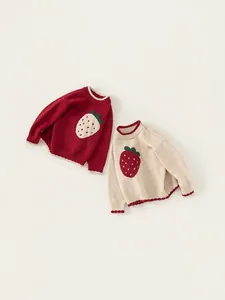 Red and beige knitted strawberry pattern sweaters for girls with long sleeves and wavy hems