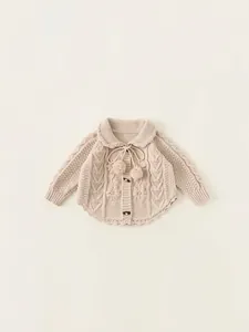 Knitted off-white toddler girl cardigan sweater with floral embroidery and pom-poms