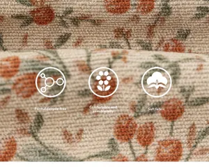 Vue macro de la texture du tissu floral montrant un matériau doux et des icônes