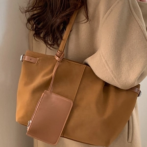 Brown large capacity tote bag with matching coin purse and adjustable leather straps