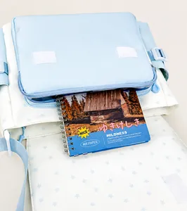 Front pocket of starry tote bag showing storage capacity for notebooks and devices