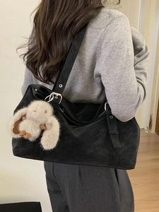 Retro black oversized tote bag with plush bunny pendant and adjustable shoulder strap