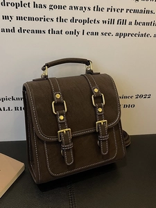 Sac à bandoulière rétro marron foncé avec surpiqûres blanches et boucles dorées