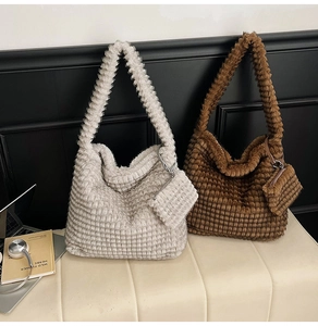 Detail of soft plush hobo bag set with quilted texture and matching small coin purse