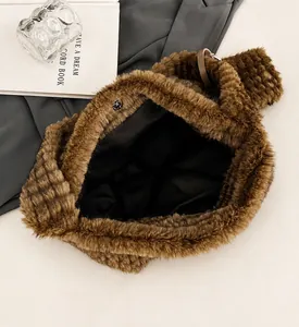 Top view of brown plush tote bag showing large capacity interior and magnetic closure