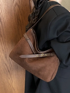 Brown suede hobo tote bag with adjustable buckle strap and smooth leather trim