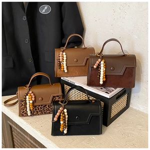 Chic small crossbody bags in black, brown, and leopard print with wood bead charms